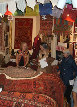 Eileen Jorgensen hard at work sharing the beauty of Oriental rugs.